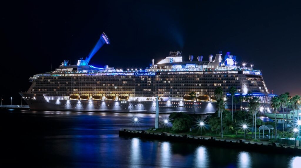 lighted ship on ocean at night