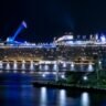 lighted ship on ocean at night