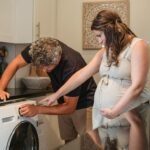 husband helping wife with laundry