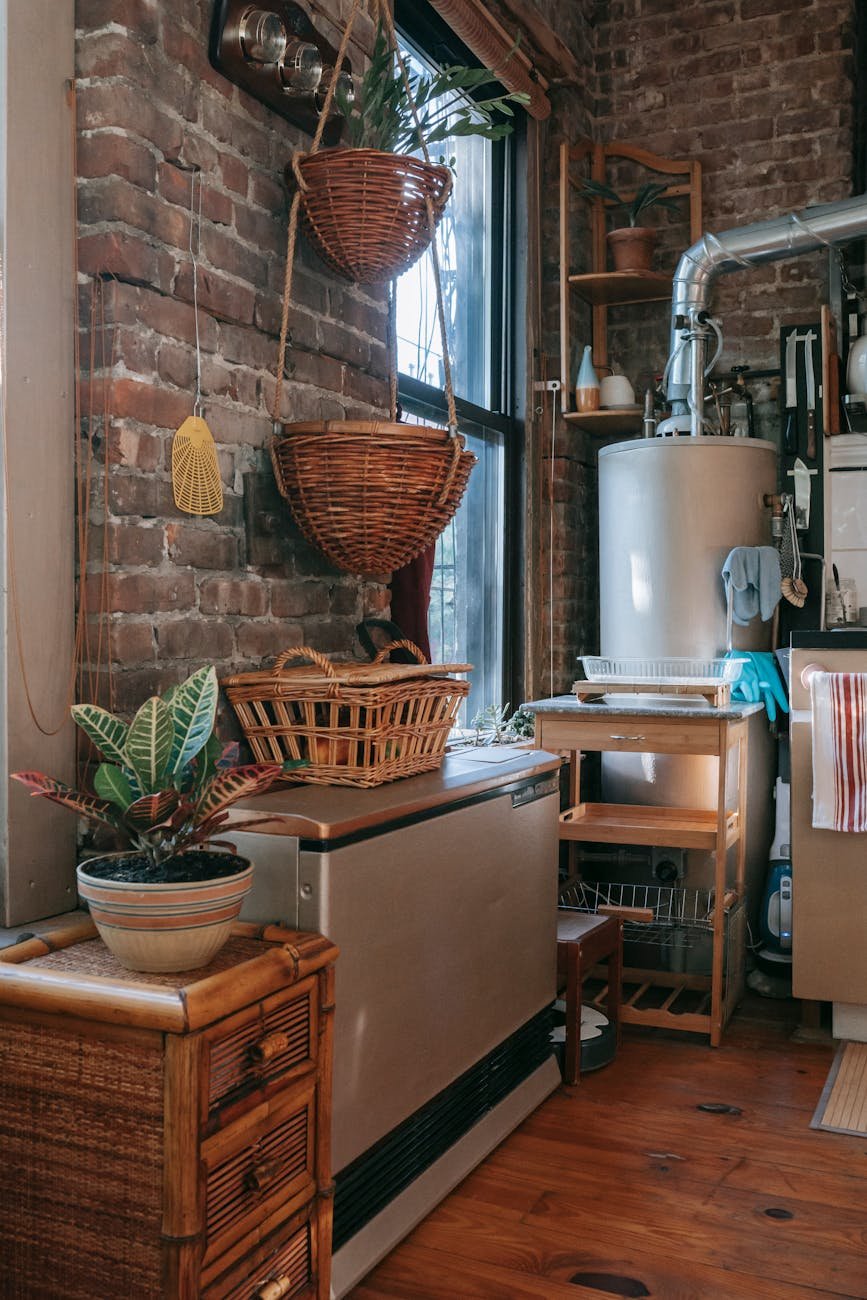 interior of kitchen with brick wall decorated with wicker baskets