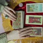 close up shot of a person holding tarot cards